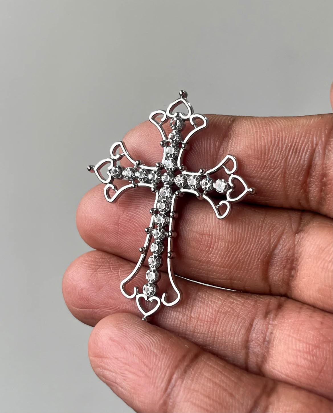 Iced out cross charm