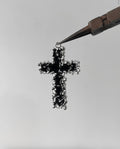 Melting cross charm